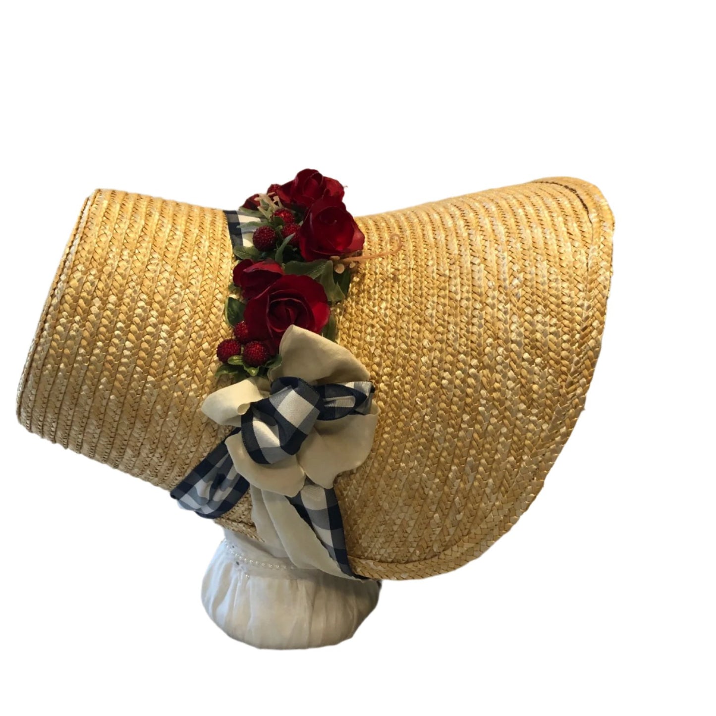 Regency style Poke bonnet with navy and white and tan ribbons and red roses. Based on an similar bonnet in Emma.