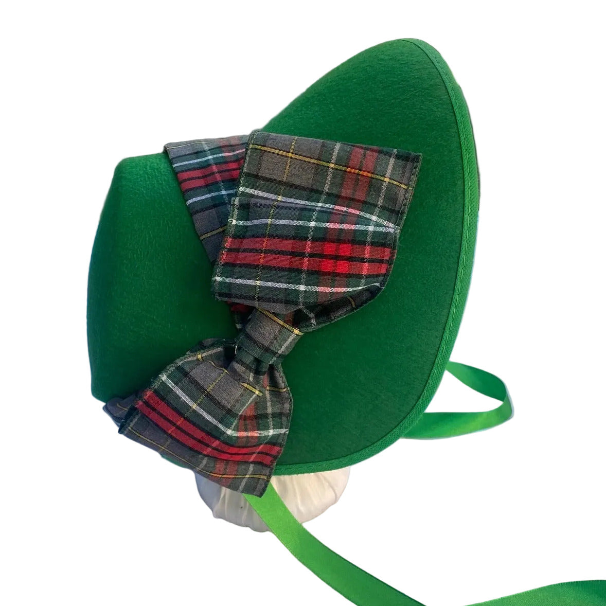 green holiday bonnet with gray and red plaid ribbon
