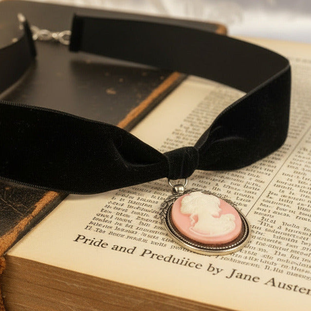 pink cameo hung from black velvet choker
