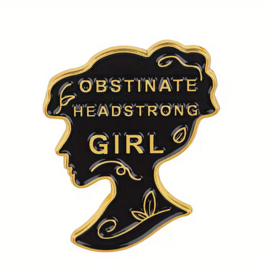 metal pin featuring Lady Catherine DeBourgh's famous quote about Elizabeth Bennet "Obstinate, Headstrong girl!" from Jane Austen's Pride and Prejudice